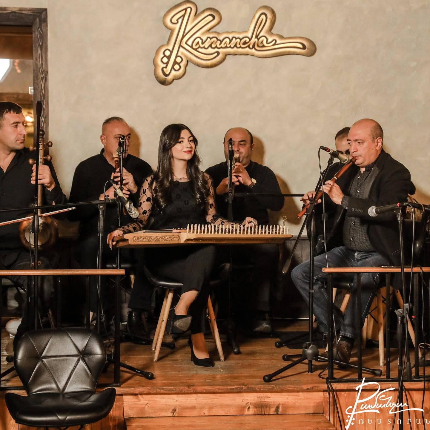 Live Armenian ensemble performing under the Kamancha sign