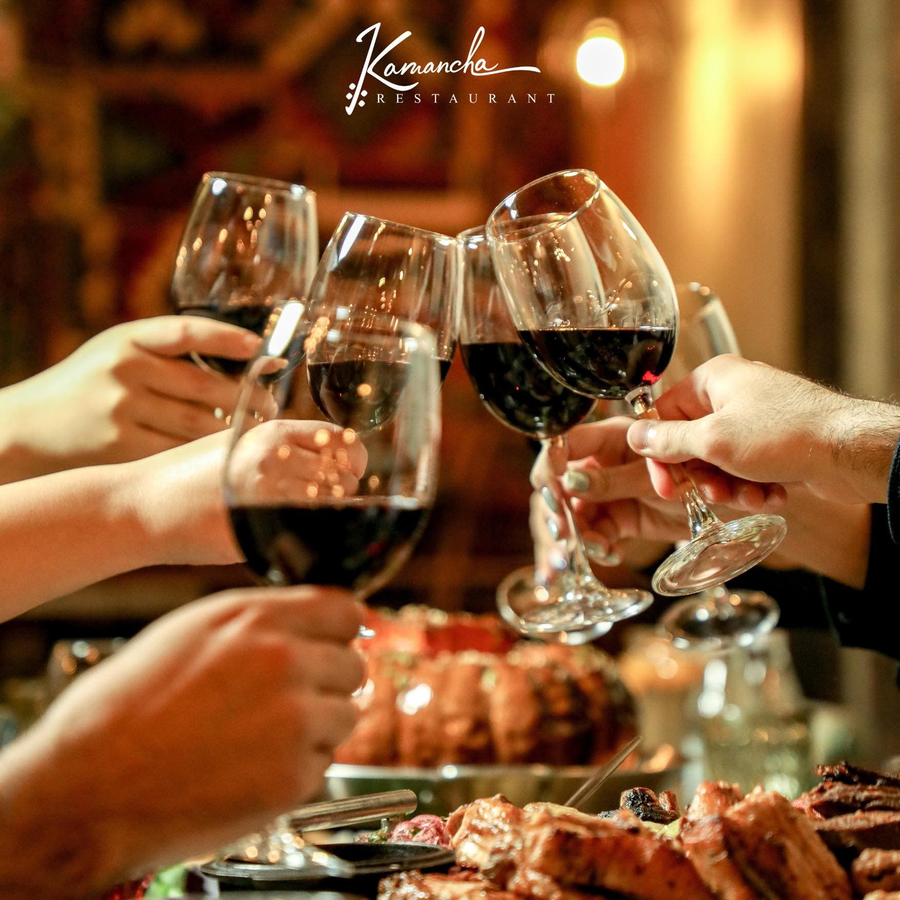 A toast with Armenian red wine over the grill
